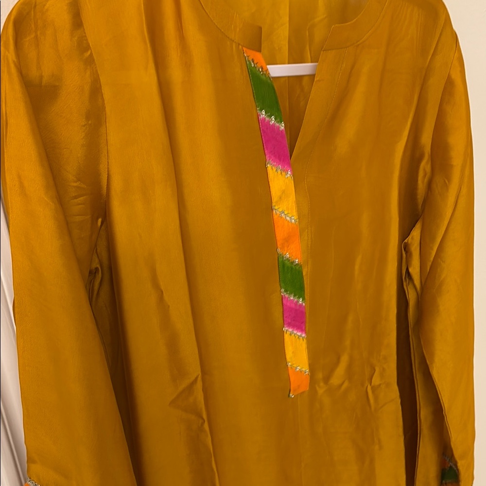 Brand new mustard kurta in medium to large size , very elegant